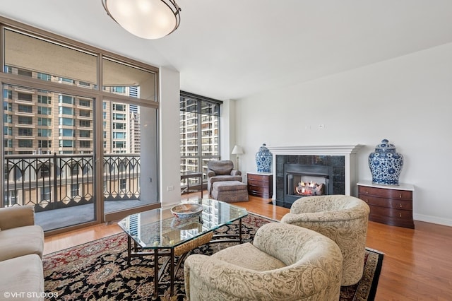 21 E Huron St Unit 1407, Chicago, IL 60611 - living area with wood finished floors, a tile fireplace, and expansive windows