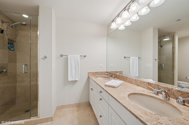 21 E Huron St Unit 1407, Chicago, IL 60611 - bathroom with a shower stall, double vanity, and tile patterned flooring