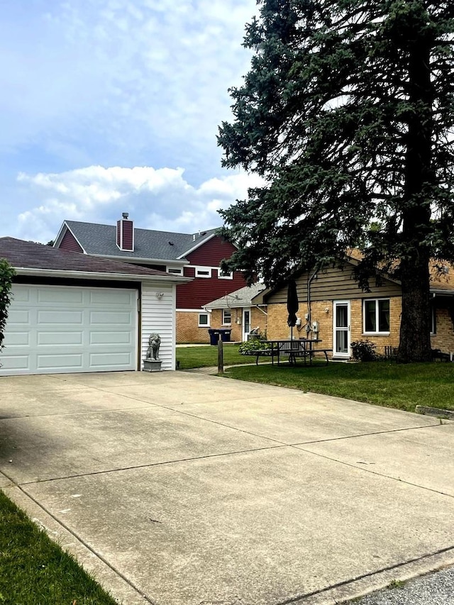 7401 W 113th Pl, Worth, IL 60482 - view of front of home featuring driveway, a chimney, a front lawn, and a garage