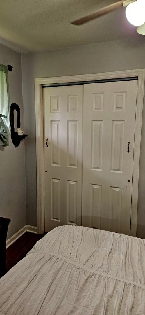 7401 W 113th Pl, Worth, IL 60482 - bedroom with dark wood finished floors, a closet, and ceiling fan