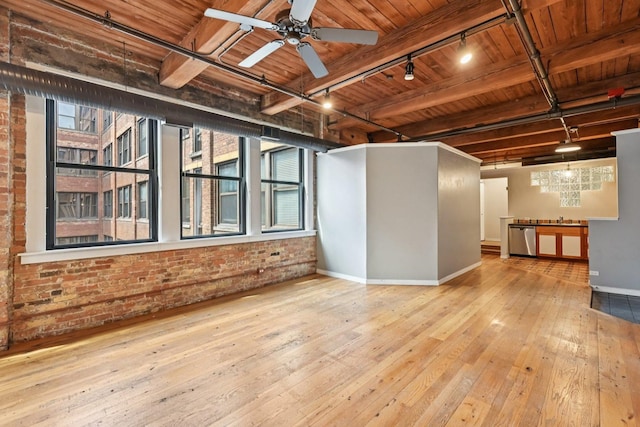 913 W Van Buren St Unit 5H, Chicago, IL 60607 - unfurnished room with a wooden ceiling with exposed beams, rail lighting, hardwood / wood-style flooring, brick wall, and a ceiling fan