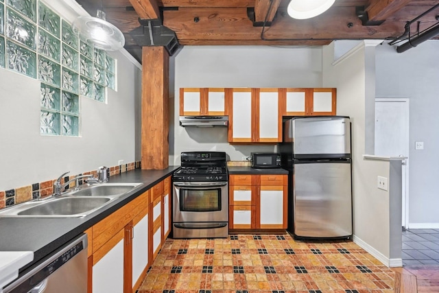 913 W Van Buren St Unit 5H, Chicago, IL 60607 - kitchen featuring stainless steel appliances, under cabinet range hood, dark countertops, and light tile patterned floors