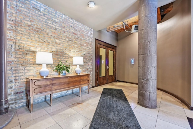913 W Van Buren St Unit 5H, Chicago, IL 60607 - entryway with light tile patterned flooring and brick wall