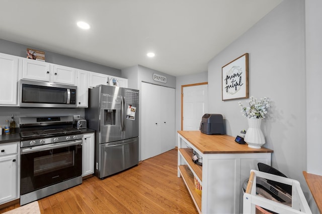 10931 Cape Cod Ln, Huntley, IL 60142 - kitchen with stainless steel appliances, wooden counters, white cabinetry, light wood-type flooring, and recessed lighting