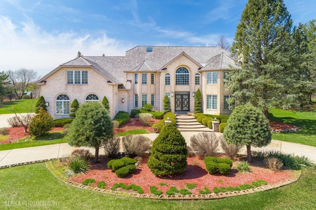 22 Westlake Dr, South Barrington, IL 60010 - colonial-style house with a front yard and brick siding