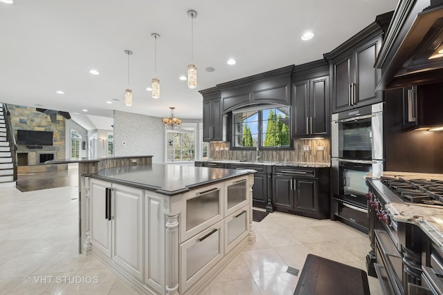 22 Westlake Dr, South Barrington, IL 60010 - kitchen featuring premium range hood, appliances with stainless steel finishes, open floor plan, recessed lighting, and backsplash