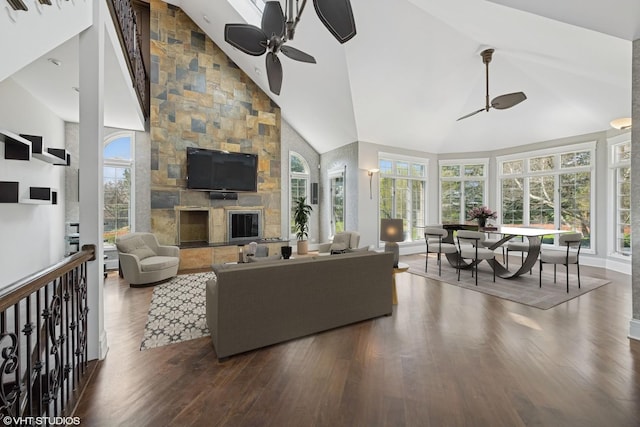 22 Westlake Dr, South Barrington, IL 60010 - living area with ceiling fan, dark wood-style floors, healthy amount of natural light, high vaulted ceiling, and a stone fireplace