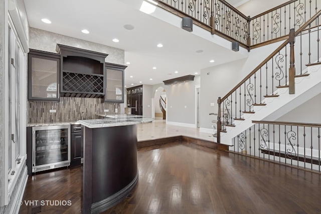 22 Westlake Dr, South Barrington, IL 60010 - indoor bar featuring beverage cooler, tasteful backsplash, dark wood-style flooring, stairs, and recessed lighting
