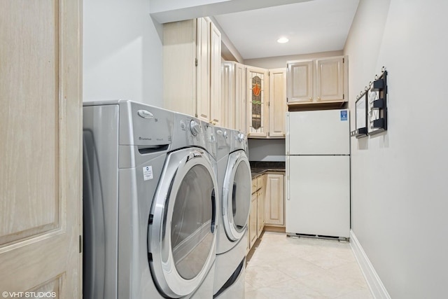 22 Westlake Dr, South Barrington, IL 60010 - washroom with washing machine and clothes dryer, light tile patterned floors, and cabinet space