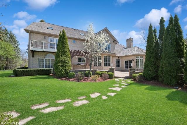 22 Westlake Dr, South Barrington, IL 60010 - rear view of house with brick siding, a chimney, a yard, a pergola, and a patio