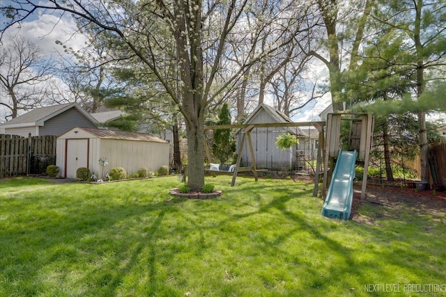 7007 W 110th St, Worth, IL 60482 - view of yard featuring a storage shed and a playground