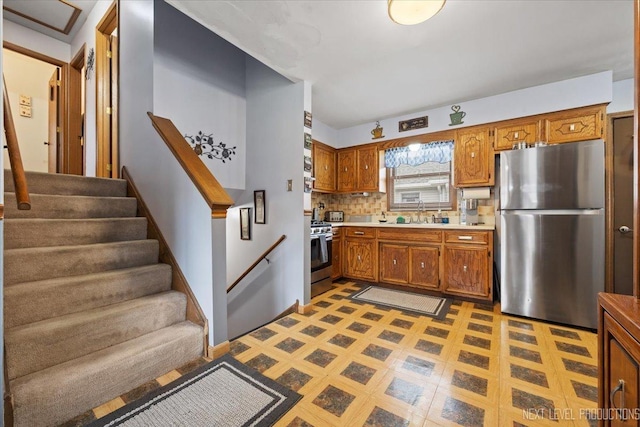 7007 W 110th St, Worth, IL 60482 - kitchen featuring appliances with stainless steel finishes, light countertops, light flooring, and brown cabinetry
