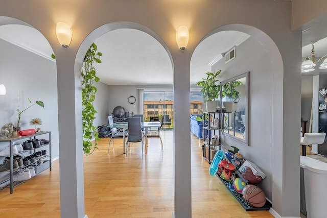 10354 Parkside Ave Unit 3A, Oak Lawn, IL 60453 - dining room featuring light wood-type flooring and arched walkways