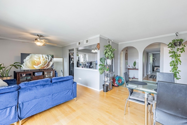 10354 Parkside Ave Unit 3A, Oak Lawn, IL 60453 - living area with arched walkways, ceiling fan, wood finished floors, and ornamental molding