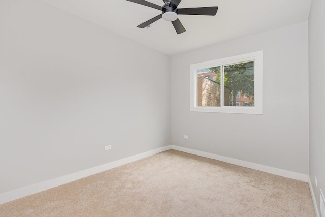 527 N Saint Louis Ave, Chicago, IL 60624 - unfurnished room featuring light carpet and a ceiling fan