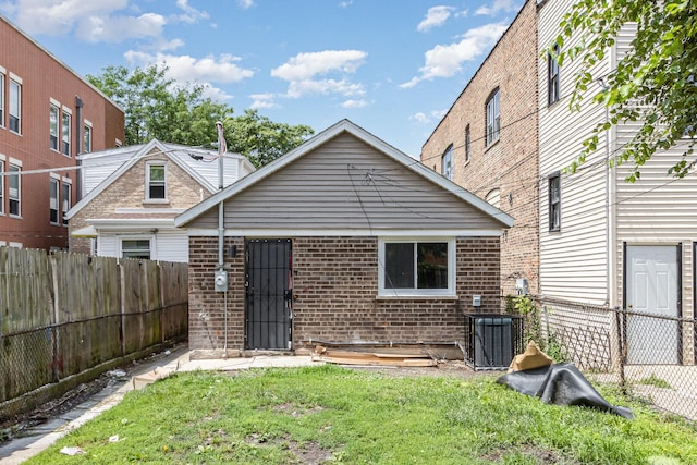527 N Saint Louis Ave, Chicago, IL 60624 - rear view of house featuring a fenced backyard and brick siding
