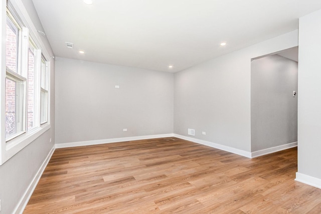 527 N Saint Louis Ave, Chicago, IL 60624 - empty room with plenty of natural light, light wood-style floors, and recessed lighting