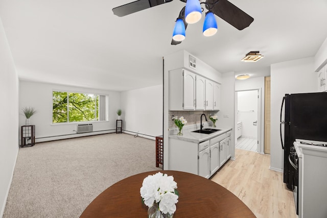1475 Rebecca Dr Unit 311, Hoffman Estates, IL 60169 - kitchen featuring white electric range oven, ceiling fan, light countertops, white cabinetry, and open floor plan
