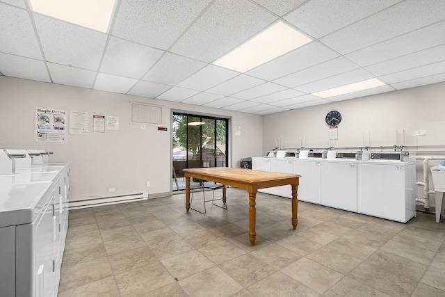 850 Des Plaines Ave Unit 405, Forest Park, IL 60130 - communal laundry room with a baseboard heating unit and washing machine and dryer