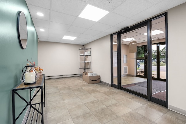 850 Des Plaines Ave Unit 405, Forest Park, IL 60130 - hall with a baseboard radiator, a drop ceiling, and recessed lighting
