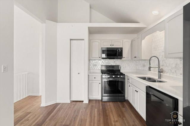 17437 Yakima Dr, Lockport, IL 60441 - kitchen with stainless steel appliances, tasteful backsplash, white cabinets, light countertops, and vaulted ceiling