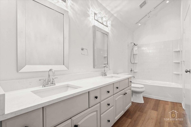 17437 Yakima Dr, Lockport, IL 60441 - full bath featuring double vanity, wood finished floors, washtub / shower combination, and lofted ceiling