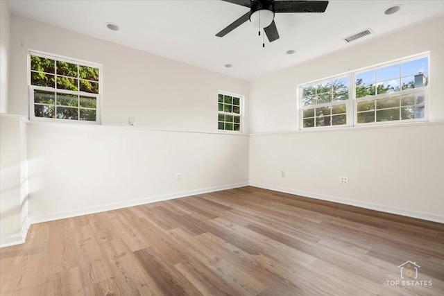 17437 Yakima Dr, Lockport, IL 60441 - unfurnished room with wood finished floors, healthy amount of natural light, and a ceiling fan