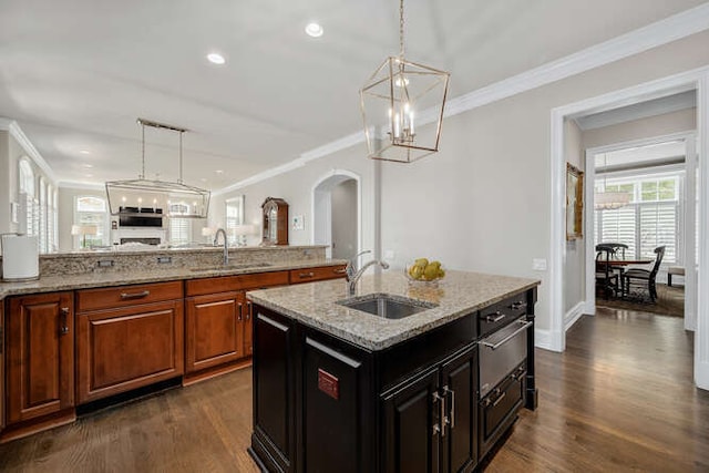 8 Willowcrest Dr, Oak Brook, IL 60523 - kitchen featuring dark wood finished floors, ornamental molding, arched walkways, a chandelier, and hanging light fixtures