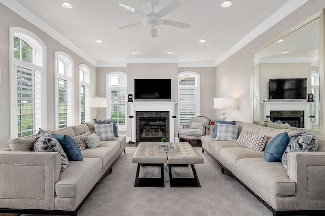 8 Willowcrest Dr, Oak Brook, IL 60523 - living room featuring a glass covered fireplace, a ceiling fan, plenty of natural light, crown molding, and recessed lighting