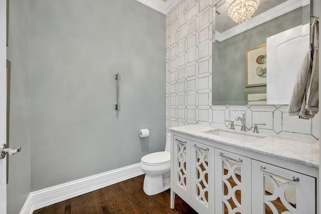 8 Willowcrest Dr, Oak Brook, IL 60523 - bathroom with vanity, crown molding, wood finished floors, and backsplash