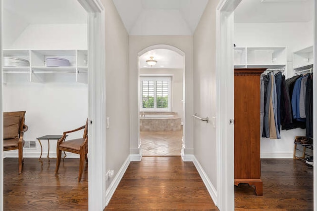 8 Willowcrest Dr, Oak Brook, IL 60523 - hall featuring dark wood-type flooring, arched walkways, and lofted ceiling