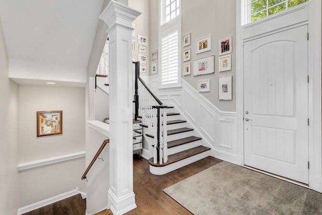 8 Willowcrest Dr, Oak Brook, IL 60523 - entrance foyer with wood finished floors, a high ceiling, ornate columns, and stairs