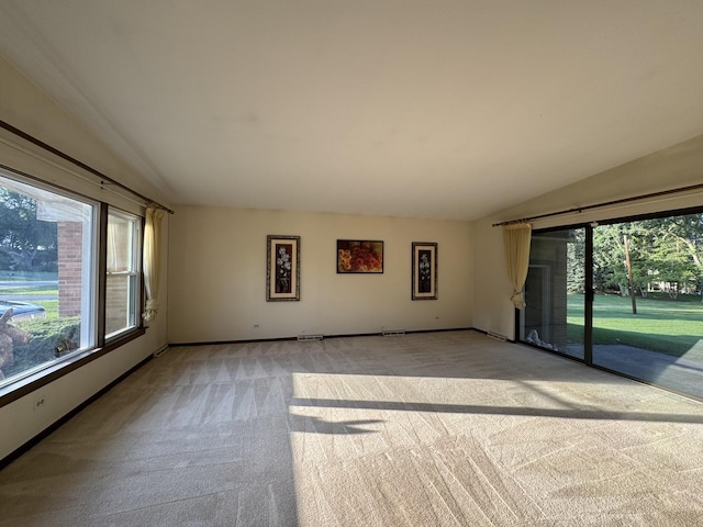 1S513 Chase Ave, Lombard, IL 60148 - spare room with light carpet and lofted ceiling