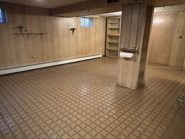 1S513 Chase Ave, Lombard, IL 60148 - basement with tile patterned floors, wooden walls, and a baseboard radiator