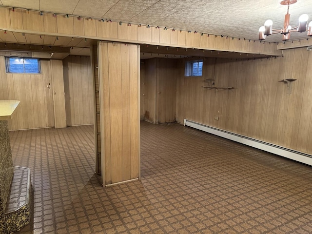 1S513 Chase Ave, Lombard, IL 60148 - below grade area with wood walls, a chandelier, and a baseboard heating unit