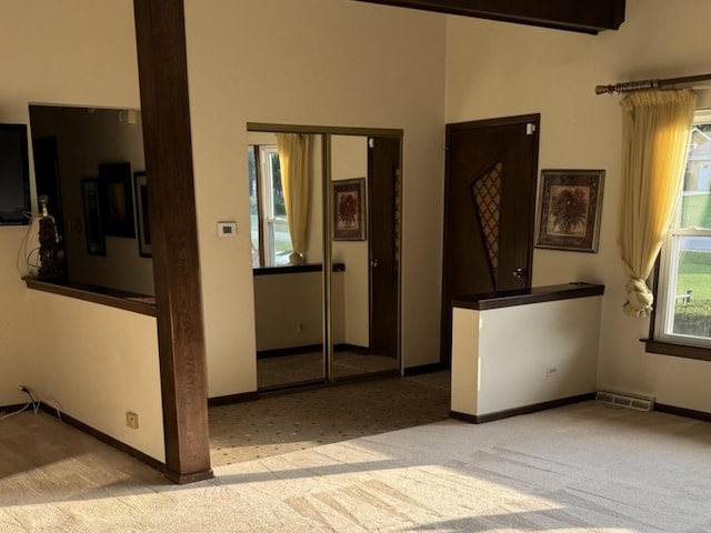 1S513 Chase Ave, Lombard, IL 60148 - carpeted empty room with baseboards and a towering ceiling