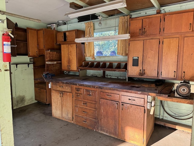 1S513 Chase Ave, Lombard, IL 60148 - kitchen featuring concrete floors, brown cabinets, and dark countertops