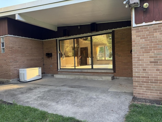 1S513 Chase Ave, Lombard, IL 60148 - view of exterior entry with brick siding and a patio area