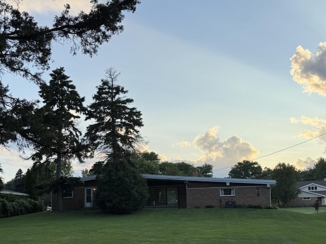 1S513 Chase Ave, Lombard, IL 60148 - rear view of property featuring a yard and brick siding