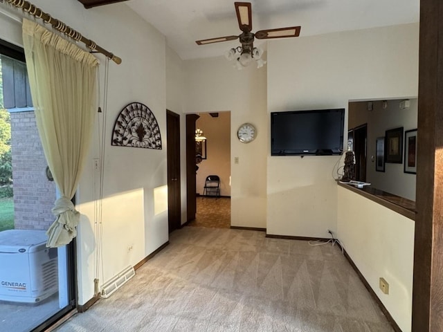 1S513 Chase Ave, Lombard, IL 60148 - empty room with carpet flooring, a ceiling fan, and a towering ceiling