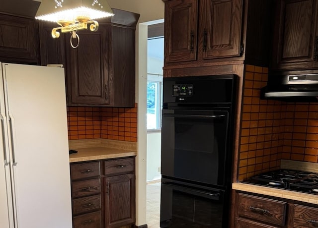 1S513 Chase Ave, Lombard, IL 60148 - kitchen with black appliances, backsplash, exhaust hood, and light countertops