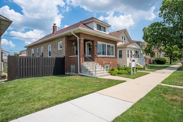 5240 W Eddy St, Chicago, IL 60641 - bungalow-style home featuring brick siding and a chimney