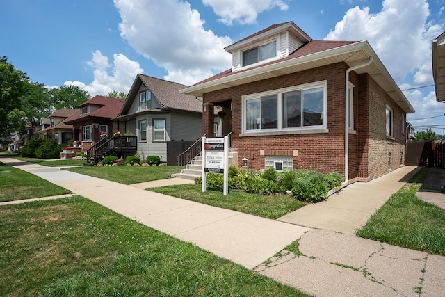 5240 W Eddy St, Chicago, IL 60641 - bungalow-style home featuring brick siding and a front yard