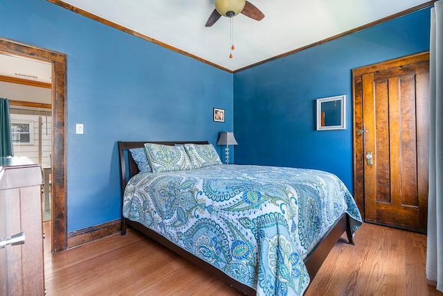 5240 W Eddy St, Chicago, IL 60641 - bedroom with crown molding, wood finished floors, and ceiling fan