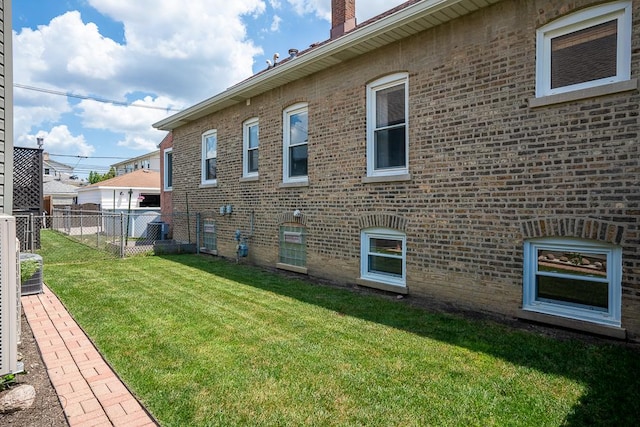 5240 W Eddy St, Chicago, IL 60641 - view of home's exterior featuring brick siding and a chimney