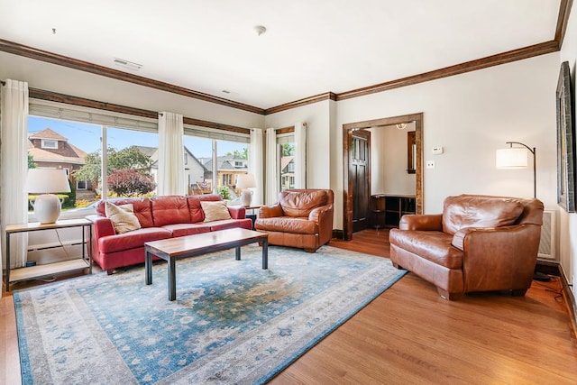 5240 W Eddy St, Chicago, IL 60641 - living room featuring wood finished floors and crown molding