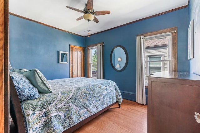 5240 W Eddy St, Chicago, IL 60641 - bedroom with crown molding, wood finished floors, and ceiling fan