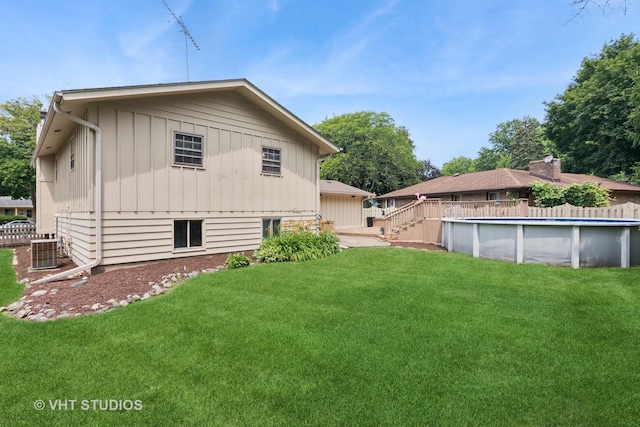 513 James Ct, Algonquin, IL 60102 - rear view of house featuring board and batten siding and a covered pool