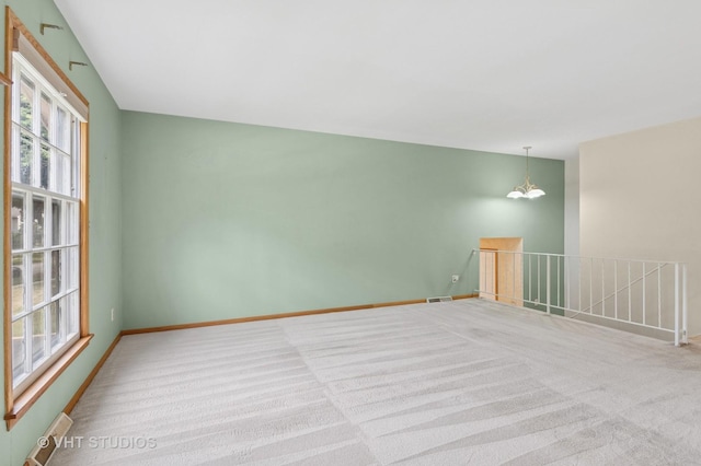 513 James Ct, Algonquin, IL 60102 - unfurnished room with carpet floors and a chandelier