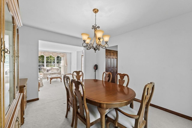 1450 Anvil Ct, Bartlett, IL 60103 - dining area featuring light carpet and a chandelier